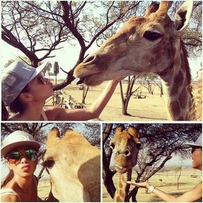 Nicoe Scherzinger: Oh me and Purty the giraffe had a grand ol' time today. She sure is purrrty! #giraffeselfie #SouthAfrica